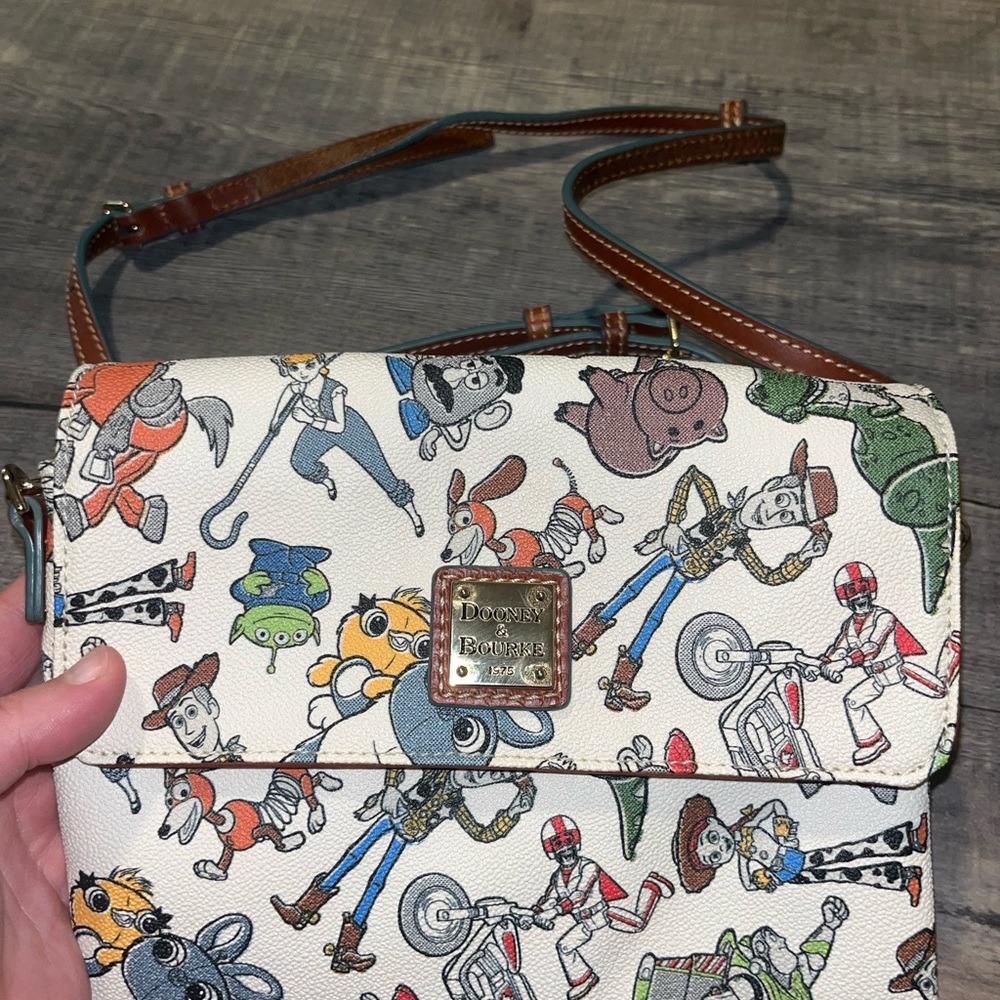 Disney Toy Story Dooney & Bourke Cream Crossbody Bag with Toy Story Characters